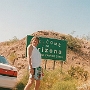 Das Schild - und der junge Mann - waren am 9.5.1995 in der Nähe von Bullhead City zu bewundern.