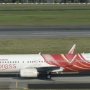 Air India express - Boeing 737-8HG (WL) - VT-AXW "Great Stupa / Charminar" tail design<br />SIN - 17.3.2023 . Crowne Plaza Runway View Room 811 - 8:41